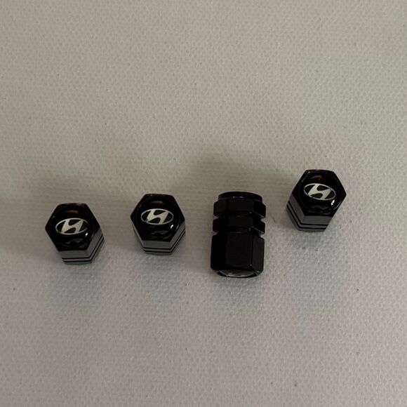 Hyundai Valve Stem Caps in Black Set of 4 NWT - Picture 1 of 3